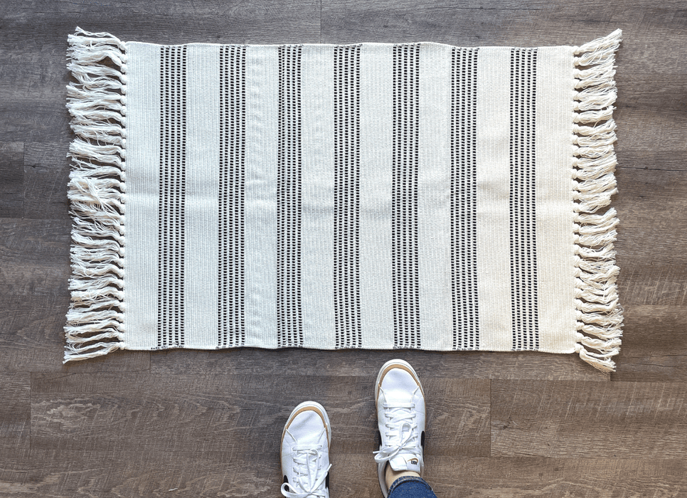 Black and White Striped Accent Rug With Fringe